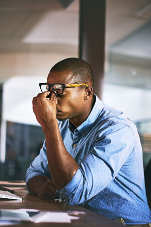 man at work with headache