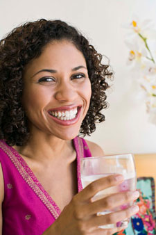 Happy woman drinking water