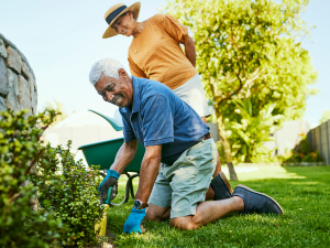 man and woman gardening outdoors