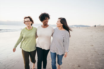 friends walking on beach