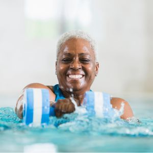 Woman exercising in pool.