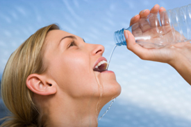 Woman drinking from a water bottle