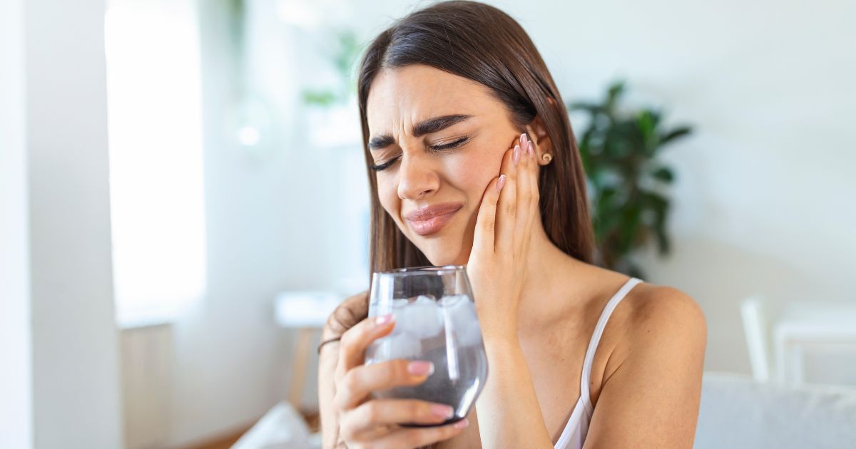 Woman drinking water.