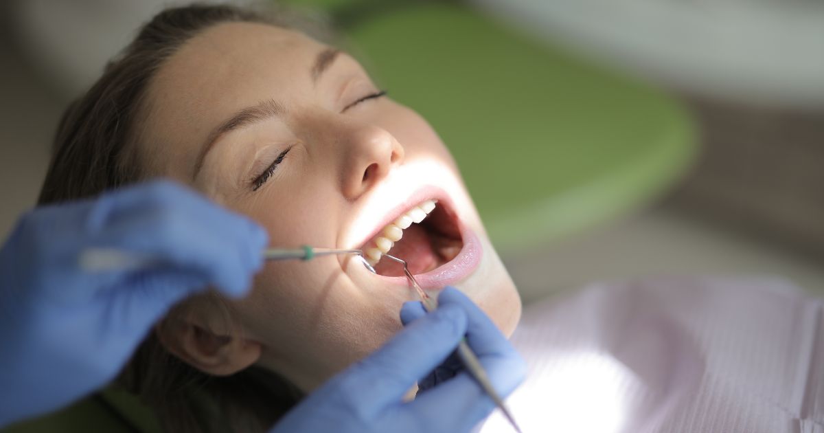 Woman in dental chair.