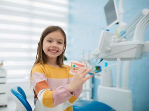 Happy girl at dentist