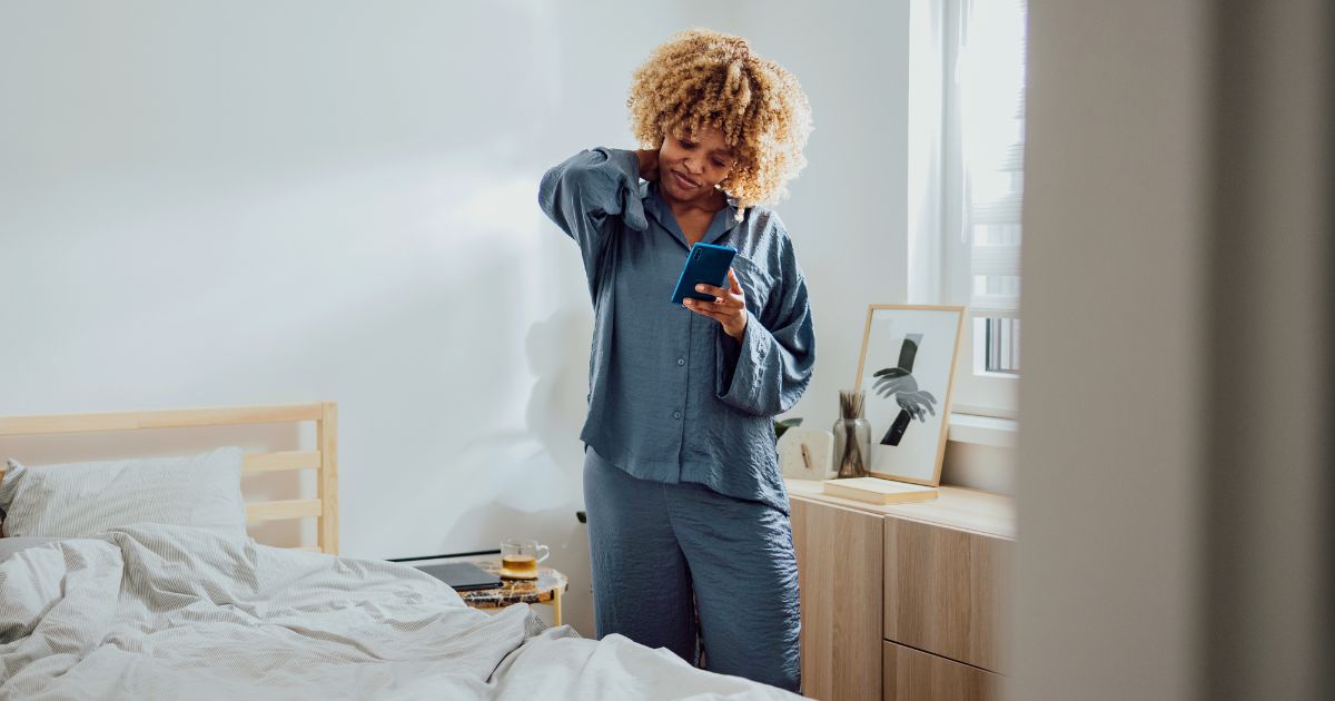 Woman looking down at phone.