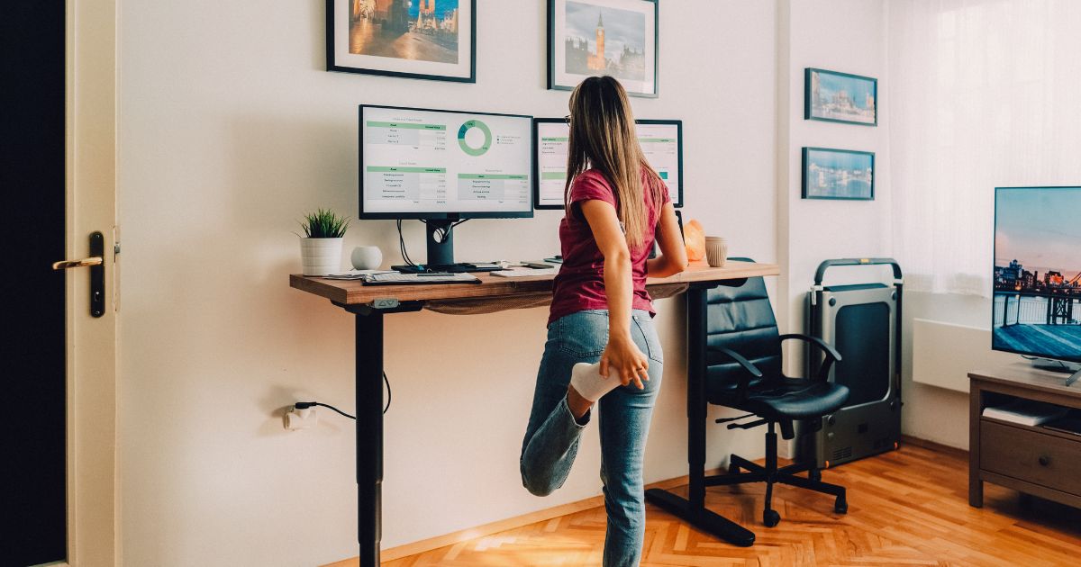 Woman at standing desk.