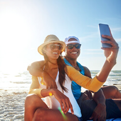 man and woman taking a selfie