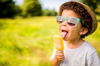 Boy licking ice cream.