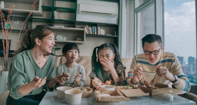 Family eating dinner together.