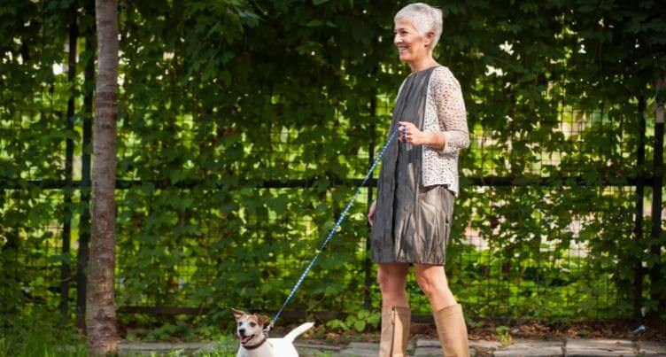 Woman walking dog.