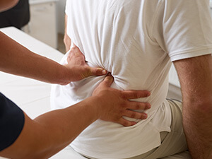 person having their back examined