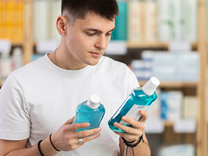 man shopping for mouthwash