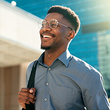 smiling man walking outdoors