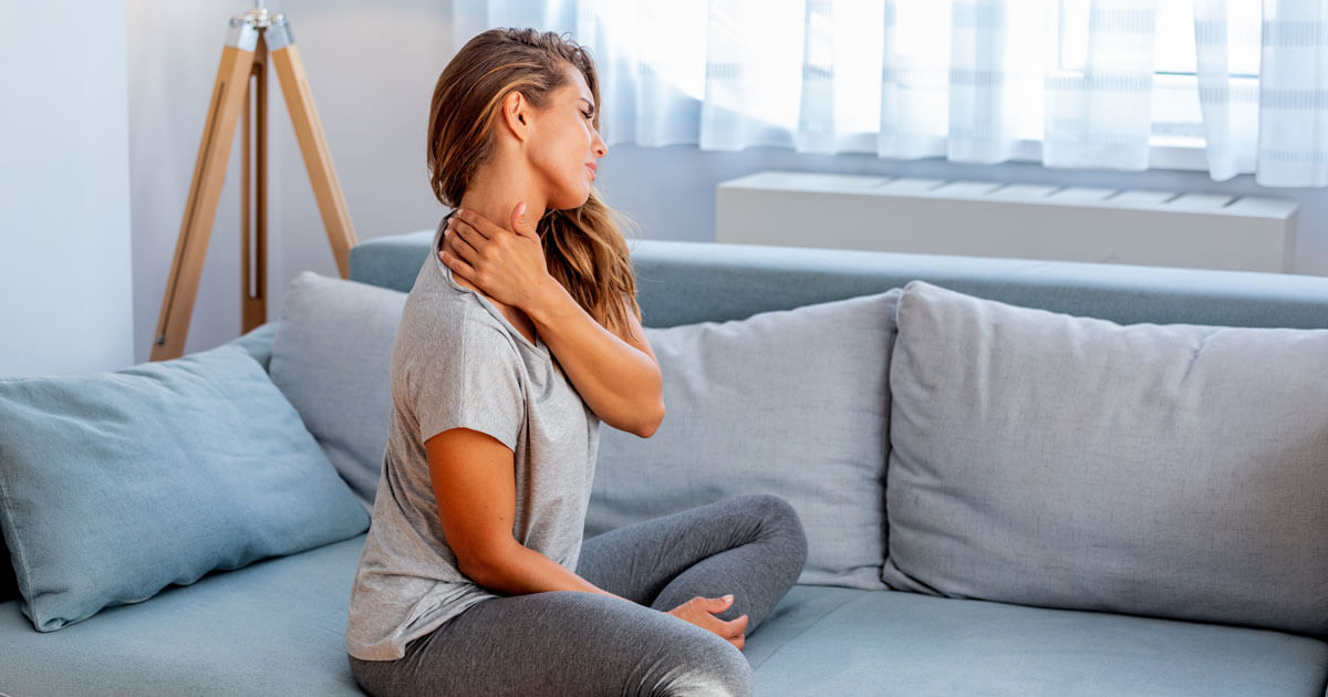 woman touching and stretching neck