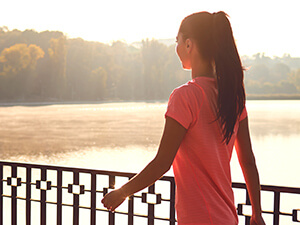 woman walking outdoors at sunset