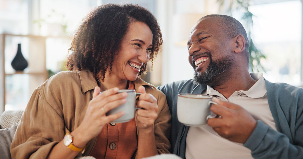 couple drinking from mugs