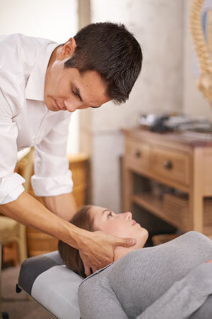 woman receiving neck adjustment