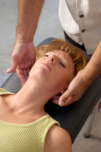 Chiropractor adjusting womans neck
