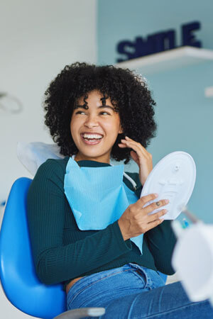 woman smiling in dental chair