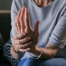 woman with joint pain in her hand