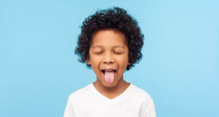 Child sticking tongue out.