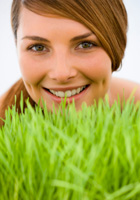 woman smiling in the grass