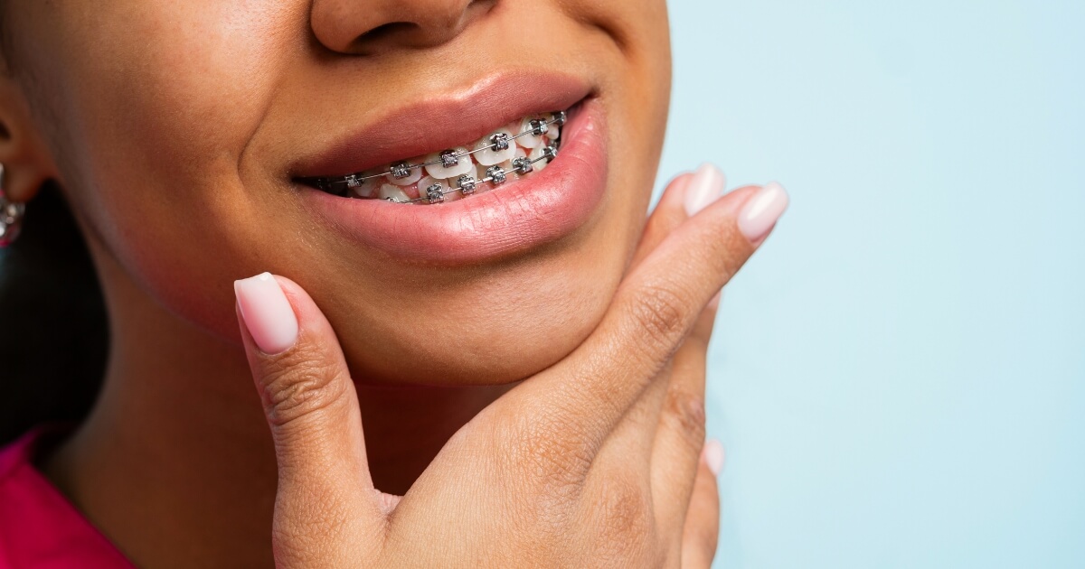 Woman with braces smiling.