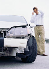 Man on phone after auto accident