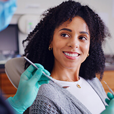 woman smiling in dentists chair