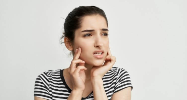 Woman with jaw pain.