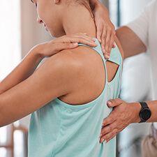 woman having back adjusted