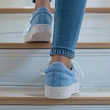 woman in shoes walking up stairs