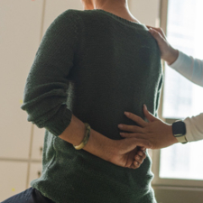 woman having back examined