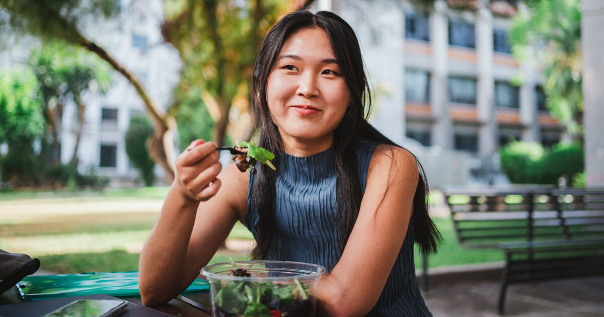 woman eating salad