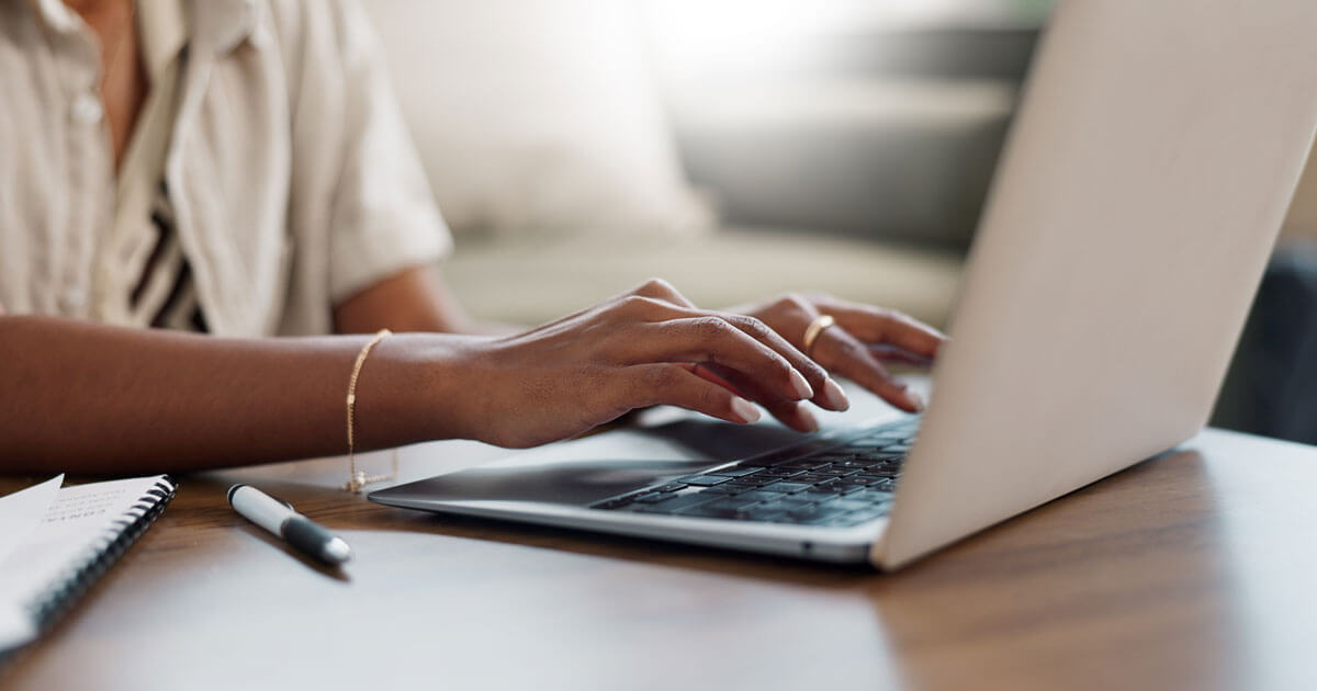 woman typing on computer