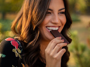 woman having dark chocolate bar
