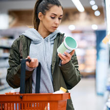 woman reading label