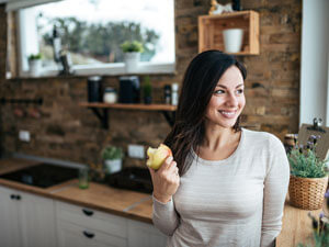 Woman eating apple