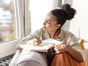 woman writing in journal