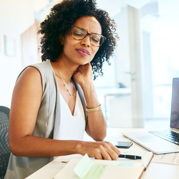 woman at work with neck pain