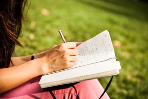 woman writing in journal