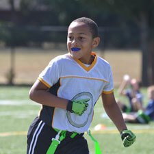 Boy playing sport with mouthguard