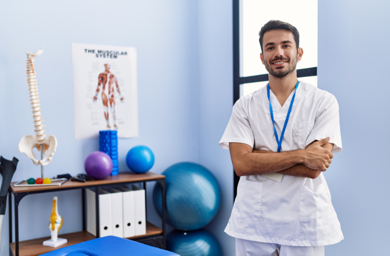 chiropractor-folding-arms-in-treatment-room