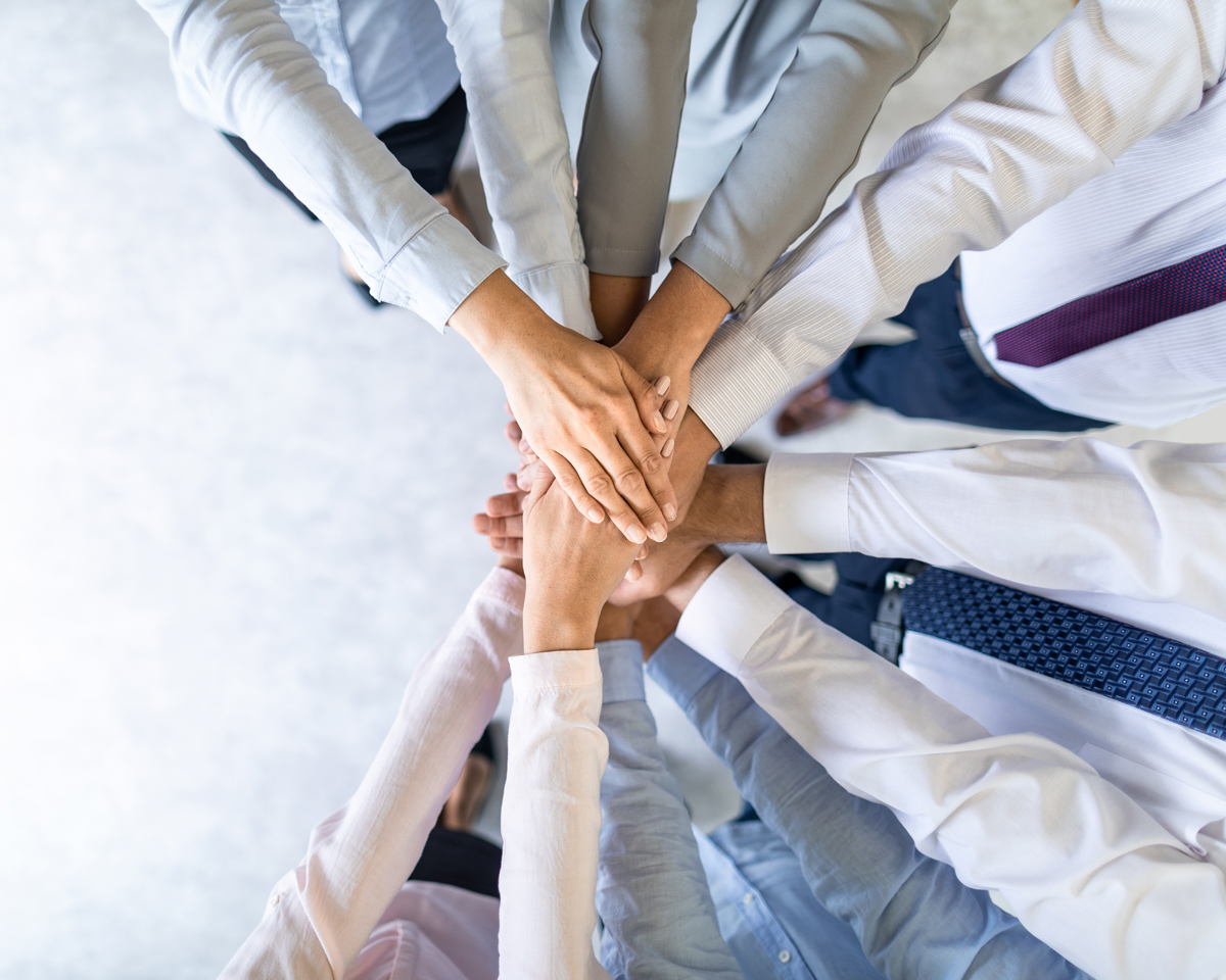 team hands together