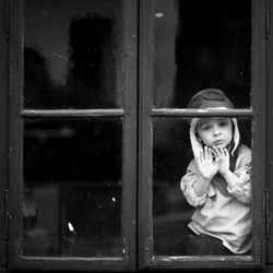 Boy with the flu in window 