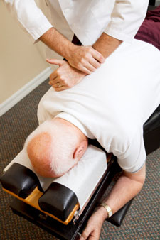 Older man getting a chiropractic adjustment