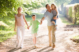 family walking on a nature path