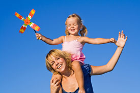 Mother and daughter playing outside