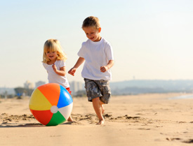 Children running on a beach